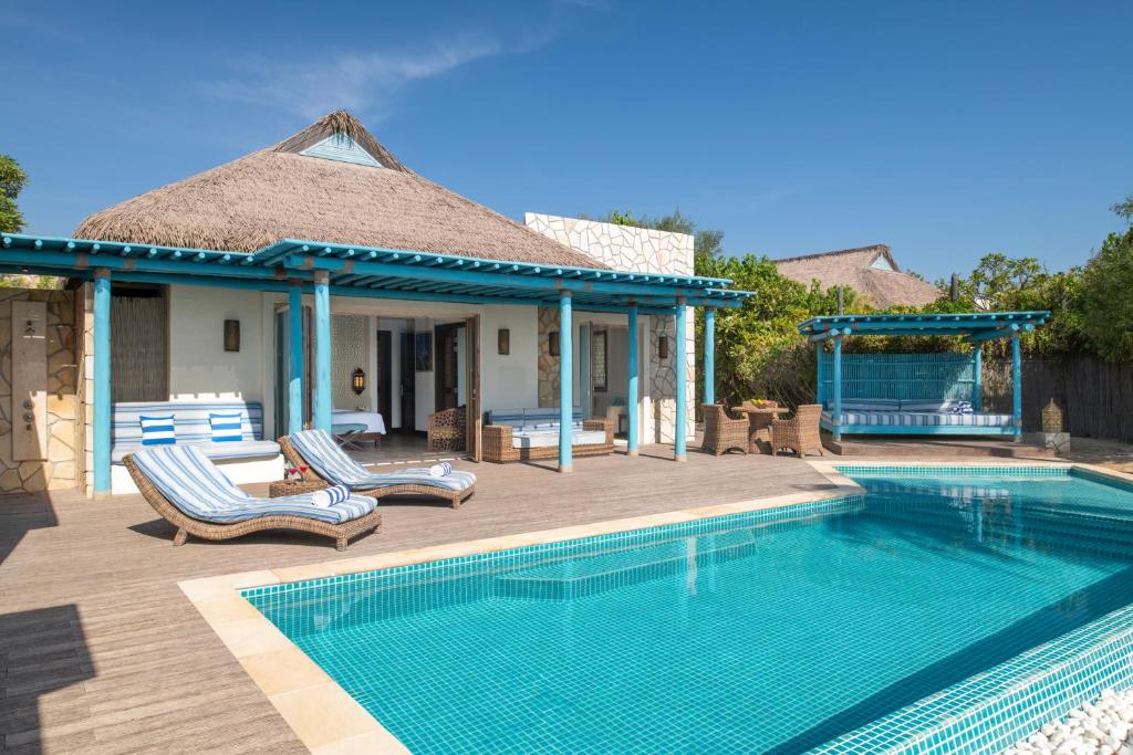A villa's private pool and shaded terrace